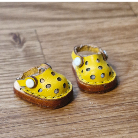 Miniature shoes yellow sandal