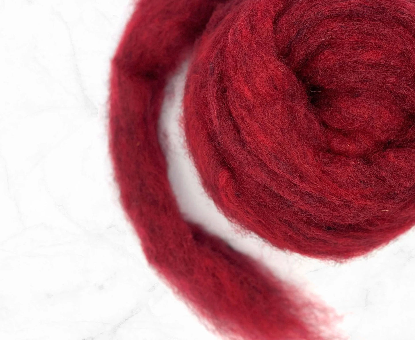 Corriedale gekaarde wol Licht rood gemêleerd - 25 gram